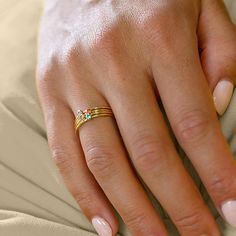 The Personalized Family Birthstones Stackable Ring in Stainless Steel is an innovative celebration of family and motherhood. Comprising a series of stackable bands in a diverse array of colors, each ring holds a single gemstone, representing the birth month of a loved one. Designed for versatility and personal expression, these rings can be worn stacked together or individually, allowing a mother to carry a symbol of her family's unity and her unique bond with each member. This set is an outstan Stackable Birthstone Rings, Stackable Bands, Stackable Ring, Birth Month, Personalized Family, Stackable Rings, Stainless Steel, Gemstones, Ring