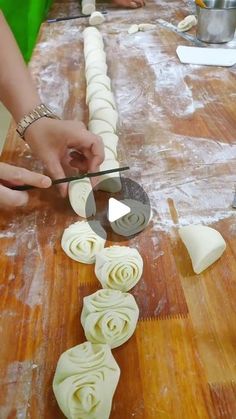 people are making food on a wooden table