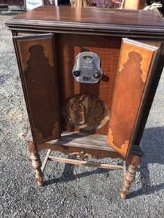 an old fashioned wooden cabinet with metal knobs