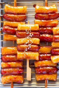 several skewers filled with lots of food sitting on top of a metal tray