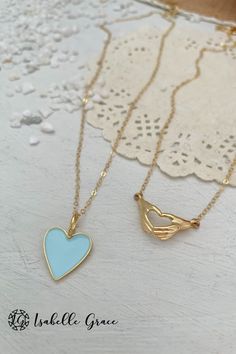 The color of summer shines bright in our Baby Blue Enamel Heart Necklace. A gorgeous and colorful addition to your collection. A beautiful enamel gold plated heart charm sparkles on a 14kt gold fill chain. Charm measures approximately 1/2 inch. Order your unique necklace here! Blue Heart Pendant Jewelry For Mother's Day, Blue Enamel Necklaces With Lobster Clasp, Heart Pendant Enamel Necklace Gift, Heart Pendant Enamel Necklace For Gift, Enamel Heart Pendant Necklace As Gift, Blue Dainty Jewelry For Valentine's Day, Blue Heart-shaped Jewelry For Mother's Day, Everyday Blue Necklaces With Charms, Everyday Blue Necklace With Charms