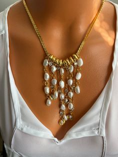 🤗 The necklace I made will make a worthy addition to your collection and will leave you spellbound while pair this casual jewel with a nice pair of earrings to complete your look ! A perfect anniversary or another speacial holiday or ocasion gift 🙏 ✔️The materials I've used for necklace are gold filled brass chain snake style , 7-8 mm size irregular shape fresh water white pearls. The tiny multiple chains in front of the necklace are cubic zirconia chains, mixed with the pearl dangles rendering a fluent and attractive appearance. The necklace can be weared on occasions and parties as well due to its classic sport style . ❗ Feel free to contact me for item questions. Each item is individually wrapped in kraft jewelry gift box. If you want to add a gift note to the package, please leave a Costume Jewelry Pearl Chain For Jewelry Making, Vintage Pearl Chain Jewelry For Anniversary, Metal Dangle Necklaces For Anniversary, Dangle Pearl Pendant Necklace For Anniversary, Pearl Chain Necklace For Anniversary, Pearl Dangle Necklace For Anniversary, Gold Pearl Necklace With Jewels As A Gift, White Chain Jewelry For Anniversary, White Dangle Necklace For Anniversary