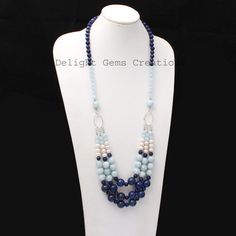 Product Details : ITEM : AQUAMARINE, LAPIS LAZULI, PEARL BEADED NECKLACEItem Code : DGC2539Gemstone Name :  AQUAMARINE, LAPIS LAZULI, PEARLChain Style : BEADEDBeads Shape : Smooth Round/RondelleBeads Size : 6mm/7mm/10mm/12 mm ApproxLength : 24"-26" Inch ApproxWeight : 530 Cts. ApproxCustomization : **Available**Please Feel Free To Contact If You Have Any Query. Elegant Blue Pearl Necklace With Colorful Beads, Blue Oval Faceted Bead Jewelry, Elegant Blue Beaded Necklace With Faceted Beads, Blue Oval Beads Gemstone Jewelry, Blue Bohemian Pearl Necklace With Gemstone Beads, Blue Oval Beaded Necklaces, Bohemian Blue Pearl Necklace With Gemstone Beads, Blue Beaded Necklaces With Oval Beads, Elegant Blue Beaded Necklace With Gemstone Beads