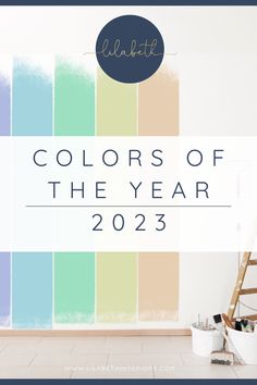 the words colors of the year in front of a wall with paintbrushes on it