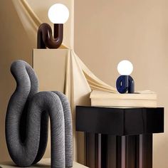 two lamps are sitting on top of a table