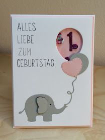 a card with an elephant holding a balloon and the number one on it's side