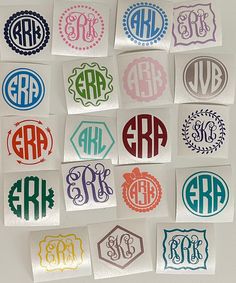 many different colored monogrammed stickers on a white surface