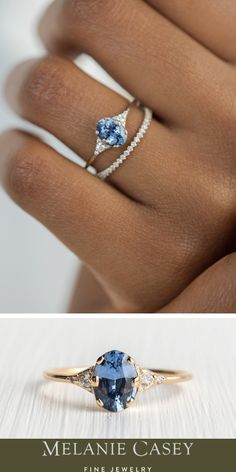 a woman's hand with an engagement ring and a blue topazte stone