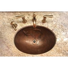 a brown sink sitting on top of a marble counter