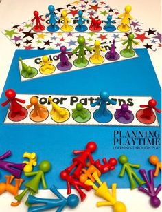 colorful peg board game with people and stars on the top, in front of blue background