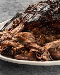 a plate full of roast beef on a table