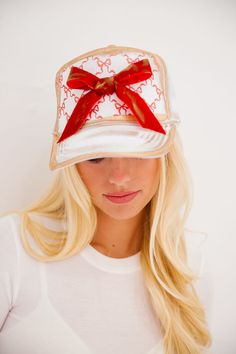 Get ready to sleigh the winter season with our Wrap Season Trucker Hat! This white trucker hat features festive gold accents and a playful print of red bows. Complete the look with the red bow patch, because we all know it's not a party without bows! All orders are currently shipping within 14 business days. To receive item quicker, expedited shipping is available at checkout. **All Christmas orders must be placed with expedited shipping to guarantee delivery by Dec. 24 if placed after Dec. 10. White Trucker Hat, Last Day To Order, Velvet Bow, Christmas Delivery, Christmas 2024, Red Bow, Winter Season, Gold Accents, The Winter