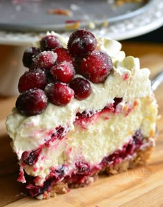 a piece of cheesecake with cranberries on top