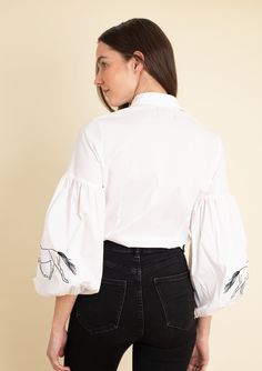 Introducing our new Annie shirt, a classic addition with an equestrian touch. Delicate horse embroidery graces the sleeves of this crisp white button-down, adding a hint of charm. Smocked details on the cuffs enhance its refined appeal, making it a perfect choice for equestrian-inspired looks. With upgraded lantern sleeves, it's both fun and elegant, catering to the modern equestrian enthusiast. Perfect for adding a whimsical touch to your wardrobe or riding ensemble. Don't miss out on the re-la Spring Workwear Shirt With Embroidered Cuffs, White Tops With Embroidered Cuffs For Workwear, Chic Embroidered Shirt For Workwear, Elegant Catering, Modern Equestrian, Horse Embroidery, Velvet Loafers, Sleepwear Dress, Equestrian Riding