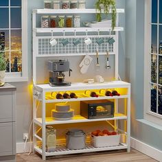 a kitchen with yellow shelving and white shelves filled with dishes, pots and pans