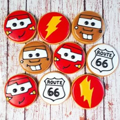 decorated cookies in the shape of cars with lightning bolt and route 66 on each one