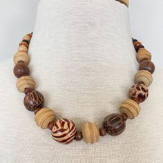 Vintage Wooden bead necklace  18 inches long  Round spring clasp  Please see pictures for size and details Wooden Beads Round Necklace For Beach, Wooden Beads Necklaces For Jewelry Making, Round Wooden Beads Necklaces For Jewelry Making, Adjustable Brown Necklace With Large Beads, Brown Necklaces With Colorful Beads, Brown Necklaces With Colorful Round Beads, Brown Round Necklaces With Colorful Beads, Wooden Beads Necklace, Brown Single Strand Beaded Necklace