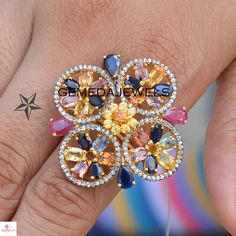 Multi Sapphire Gemstone Ring, 925 Silver Gold Plated Ring, Pave Diamond Ring, Gemstone Silver Ring, Flower Ring Jewelry, Bridesmaid Gifts Gross Weight: 11.96 gram Gemstone Weight: 10.03 cts Diamond Weight: 1.01 cts Stone: Sapphire, Ruby, Diamond Ring Size: 36X36 MM NOTE:- All The Products Are Designed And Manufactured In My Workshop By Me & My Team. Shown Products Are Purely Handmade. Custom Orders Are Open Handly Accepted. We Are Perfect Choice For Any Custom Jewelry Manufacturing. For Bulk Fine Jewelry Floral Rings With Accent Stones, Fine Jewelry Flower Ring With Accent Stones, Flower Shaped Multi-stone Wedding Jewelry, Flower-shaped Multi-stone Wedding Jewelry, Fine Jewelry Flower-shaped Multi-stone Rings, Flower Shaped Rings With Accent Stones For Anniversary, Flower-shaped Rings With Accent Stones For Anniversary, Flower-shaped Anniversary Rings With Accent Stones, Diamond Multi-stone Flower Ring