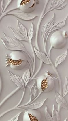 an artisticly designed wallpaper with white and gold ornaments on it's surface