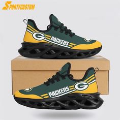 the green bay packers sneakers are on display in front of a cardboard box with it's logo