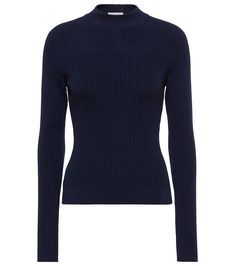 This top from Alaia is designed with the label's signature form-flattering ribbed-knit technique. It's made from a wool blend with an alluring open back that offsets the high neck. | Alaia Ribbed-knit wool-blend top Elegant Ribbed Merino Wool Tops, Classic Ribbed Merino Wool Top, Blue Wool Fine Knit Tops, Luxury Merino Wool Knit Top, Blue Fine Knit Merino Wool Top, Spring Knits, Wide Leather Belt, Spring Bags, Knit Pants