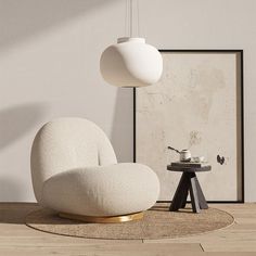 a white chair sitting on top of a wooden floor next to a table and lamp