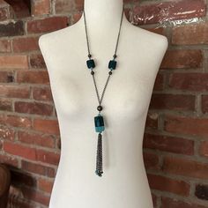 "Eye catching turquoise blue hand blown glass pendant necklace with chain tassels and bead ends, 2 similar glass beads  on either side on a Dark metal colored chain. Measured flat  and together, the necklace, including tassels is 19\"  Perfect necklace that can be worn with a casual or a dressed up outfit, In very nice condition, giftable   Pendent length  without tassels: 1.5\" by .75\" approx. Tassels length: 3.5\" approx" Rose Gold Statement Necklace, Bronze Chain Necklace, Glass Pendent, Blown Glass Pendant, Dark Metal, Gold Statement Necklace, Pendent Necklace, Ceramic Pendant, Glass Pendant Necklace