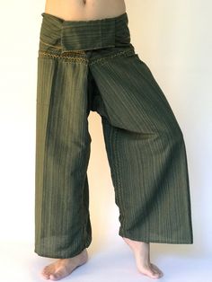 "Unisex Thai fisherman pants. One size fits all. You can wear in many occasions, casual wear, yoga wear, maternity wear, relax at home, travel etc. If you are looking for some pants that you can wear everywhere, comfortable, relax and Easy to wear. Thai fisherman pants is Answer!! Nice gift for yourself or your lover One pocket on the side for storing your items such as wallets, mobile phones, etc Approx. Measurements: One size can fits most and 1 Pockets Measurement Waist 27\" (69 cms) Length 4 Traditional Cotton Stretch Bottoms, Traditional Stretch Cotton Bottoms, Green Cotton Stretch Yoga Pants, Relaxed Fit Straight Leg Harem Pants For Yoga, Green Stretch Cotton Capris, Casual Bottoms For Meditation, Casual Long Pants For Meditation, Green Wide Leg Yoga Pants With Pockets, Comfortable Stretch Green Pants