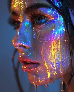 a woman's face is covered in holographic paint