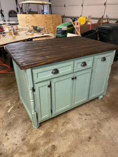 a kitchen island made out of an old cabinet