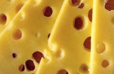 several slices of cheese with holes in the middle