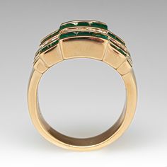 This colorful alternating wide band ring is accented with ten (10) round brilliant cut diamonds, and eighteen (18) square step cut natural emeralds set into channels. The ring measures 11.5mm at the top, rises 4.4mm above the finger, tapering to 4.7mm wide and 1.4mm thick at the base of the shank. The ring crrently fits a 5.5. Luxury Green Channel Set Rings, Luxury Emerald Ring With Diamond Channel Set, Luxury Emerald Rings With Channel Set, Luxury Emerald Rings Channel Set, Luxury Emerald Diamond Ring With Channel Set, Luxury Formal Emerald Ring With Channel Set, Luxury Channel Set Emerald Ring For Formal Occasions, Formal Green Channel Set Emerald Ring, Luxury Channel Set Emerald Ring For Anniversary