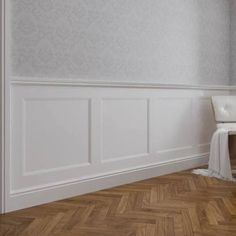 an empty room with white walls and wood flooring on the parqueted wooden floor