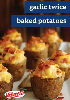 some baked potatoes with bacon and cheese in them