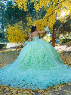 Receive lots of compliments in this floral glitter applique long strapless corset dress with an A-line skirt from LizLuo Quince by the House of Wu 26094. This stunning quinceañera ball gown boasts a one-of-a-kind beaded pattern that accentuates the entire bodice. The basque waistline shapes and frames the full ball gown skirt, while the floral glitter fabrics create an ultimate sparkle effect. Additionally, sheer ruffle fingerless gloves add a sweet touch to the ensemble. House of Wu LizLuo Quin Neon Quinceanera Dresses, Sweet 16 Dress Green, Teal Quinceanera Dresses, Turquoise Quinceanera Dresses, 1500 Dresses, Strapless Corset Dress, Cotillion Dresses, Strapless Ball Gown, Quinceñera Dresses