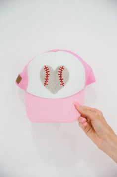 Hey Batter Hey! This one is for all the ballpark mini's, the MINI KIDS HEY BATTER TRUCKER HAT is perfect for your little one. Whether it's a long tournament day or a day spent watching your favorite team, this pink and white trucker hat will have your mini covered!

Trucker Hat Product details:

Snapback style
Ponytail opening 
Mesh in the back of hat
100% Polyester Baseball Season Snapback Cap For Game Day, Adjustable Fitted Hat For Sports Fans, Pink Trucker Hat For Baseball Season With Curved Brim, Team-colored Snapback Hat For Baseball Season, Pink Trucker Hat For Baseball Season, Pink Trucker Hat For Sports Events, Adjustable Baseball Cap For Game Day, Game Day Fitted Baseball Cap, Sports Fan Baseball Cap For Game Day