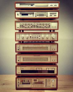 a stack of old radio's sitting on top of each other