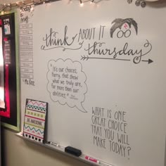 a white board with writing on it and lights strung from the ceiling above it that says, think about it thursday what is one great choice that you will make today?