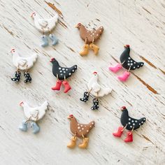 small wooden birds with polka dots on them