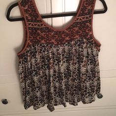 Black, Tan And White Loose Sleeveless Top Brown Summer Vest Top, Brown Casual Sleeveless Tank Top, Brown Vest Top For Summer, Casual Brown Sleeveless Tank Top, Casual Brown Tank Vest, Sleeveless Brown Cotton Top, Brown Sleeveless Cotton Top, Casual Brown Tank Top For Spring, Brown Tank Vest Top