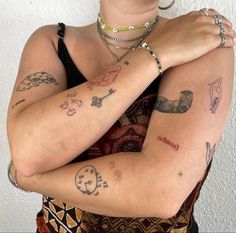 a woman with many tattoos on her arm