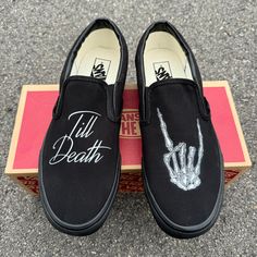 Till Death customized Black/Black Vans Slip Ons with the rocker hand.These Vans are perfect for a wedding gift for a bride and groom. Custom Made-to-Order shoes. Looking for these in white? Grab them here: https://bit.ly/48jAKLm We source each pair of blank shoes BRAND NEW from the Vans retail store. The ink is permanent and will never come off. Made in the USA. This price includes everything: shoes, artwork, and shipping. Please message us with any questions!Sizes listed are in US sizing scale. Romantic Goth Wedding, Shoes Artwork, Wedding Vans, Vans Slip On Shoes, Custom Wedding Shoes, Halloween Shoes, Nike Converse, Black Slip On Shoes, Goth Wedding