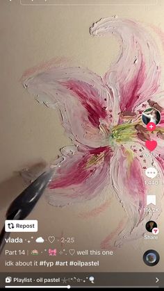 someone is painting a flower on the wall with pink and white paint, then it's red