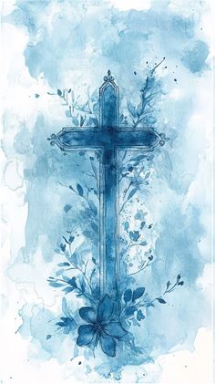 watercolor painting of a cross with blue flowers and leaves on the bottom half of it