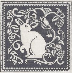 a cross stitch pattern with a rabbit on it