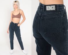 "Vintage 90s jeans by Bongo in black denim with a high waist. Skinny mom fit. Please see measurements and condition below. Every garment we sell is authentic vintage! You will receive the exact item photographed. Condition: Very good vintage. Best fits women's: Extra small/0 Tag: bongo Material:  Denim MEASUREMENTS Taken from seam to seam while the garment is lying flat. Double the armpit, waist, and hips For reference, model is 5'7\" and measures 31-23-35. Waist: 12\" Hips: 17.5\" Inseam: 29.5\ Jeans Bongo, Bongo Jeans, 90s Jeans, High Waisted Denim, Vintage Denim, Shades Of Purple, High Waist Jeans, Black Denim, Denim Pants