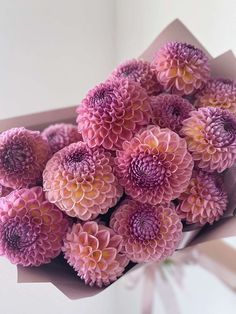 a bunch of pink flowers in a vase