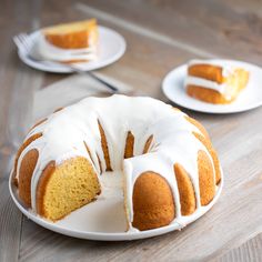 a bundt cake with white icing on a plate