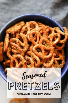 a bowl full of pretzels with the words seasoned pretzels above it