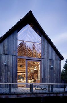 a large wooden building with lots of windows